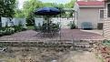 Summer 2010 I laid the brick and granite patio, the area to the south of the patio was the prepping ground for the stone.  Spring of 2011 the area looked as shown in the foreground here.