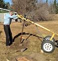 Rented a gas-powered auger, to create four holes, each 12" in diameter.