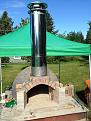 Oven complete, with chimney in place. Sure makes the oven look tiny! I've since stuccoed the dome, and will eventually build a protective 'hut' over the whole thing.