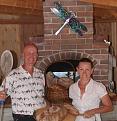 Mike & Susan at the oven with a bread batch (8/2010)