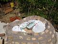 Plastic bags full of builders sand stacked on the Styrofoam/plywood platform.