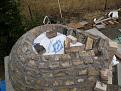 Covered the sand form with a plastic bag to keep sand out of the mortar and to help keep the form shape.