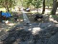 Fabric down, gravel delivered, now the work begins. My back is to the den in this picture and the path will lead to the woodshed and my pump house at the river.