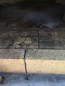 Cracks in entryway arch floor due to ice, which also pushed the floor apart.