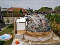 Sand dome covered in news paper strips