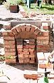 The brick arch, part mortered, part wedged.