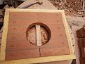 All twelve bricks in a wood frame, hole is large enough for the bottom round of the chimney plate to set in to.