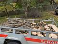 Loading up the cuts ... kindling piled in background