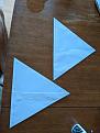 Triangle templates made from paper.