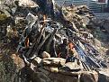 Site of oven at Cramps bay Great Lake. Levelling rock by fire, water and Spaulding hammer